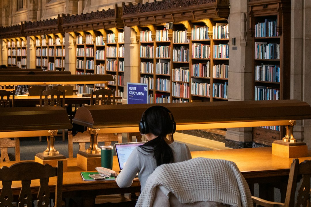 Student reviewing academic work in a library